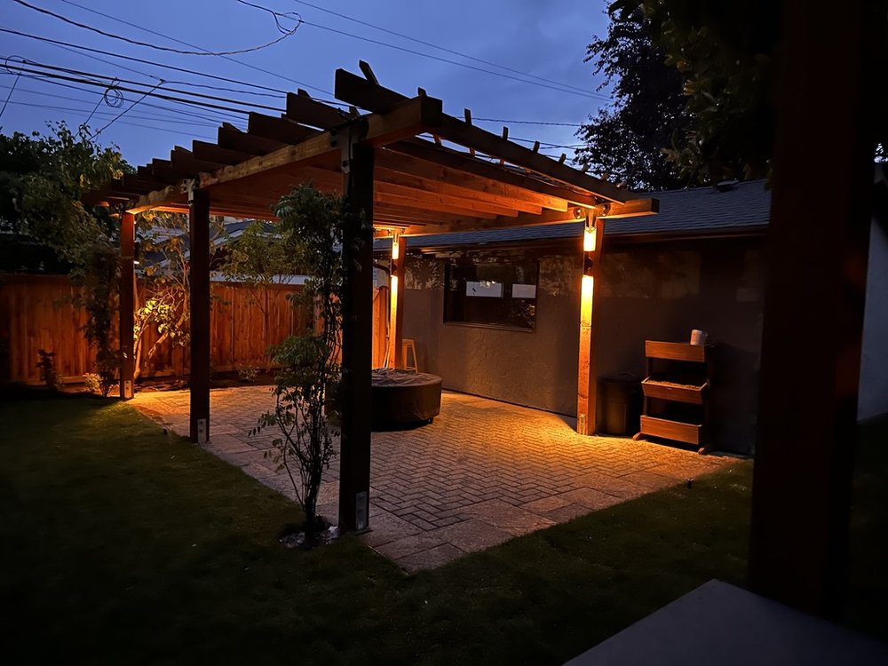 ssl4 West Seattle outdoor pergola at night with lighting.