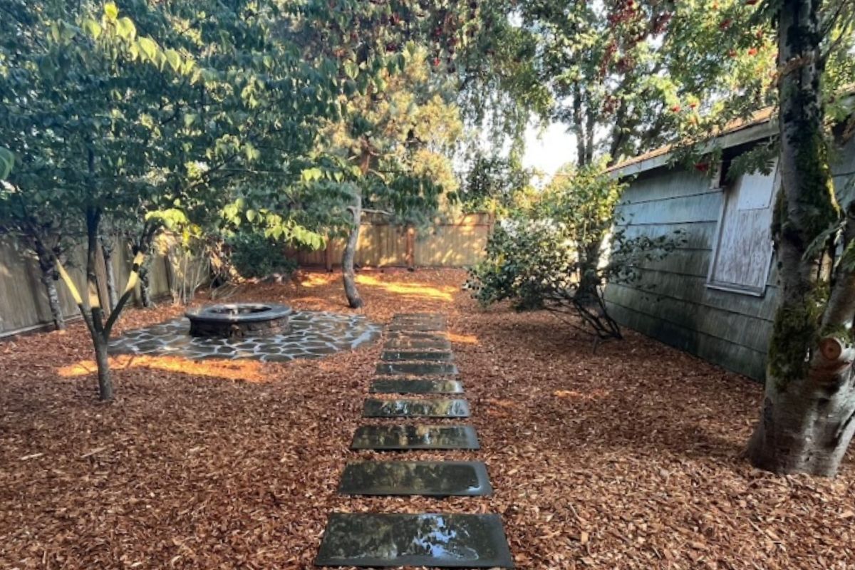 Mulched garden beds in a Seattle yard during winter