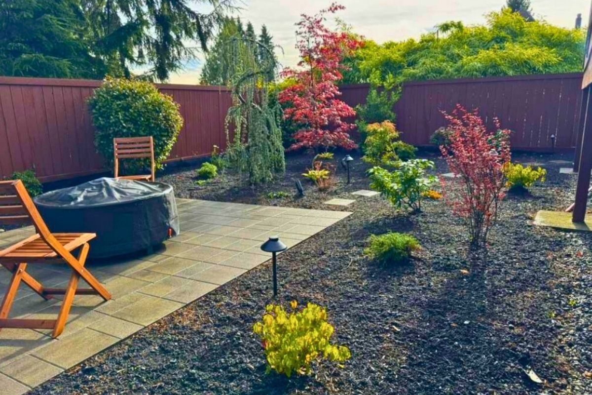 Native landscaping framing a seating area