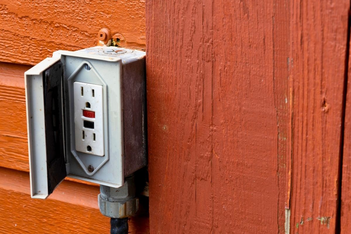 Landscaper charging batteries from an exterior outlet