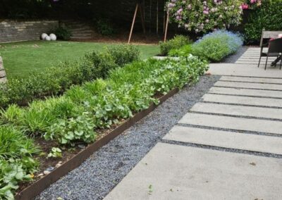 Olimipic stepping stones with gravel and native planting