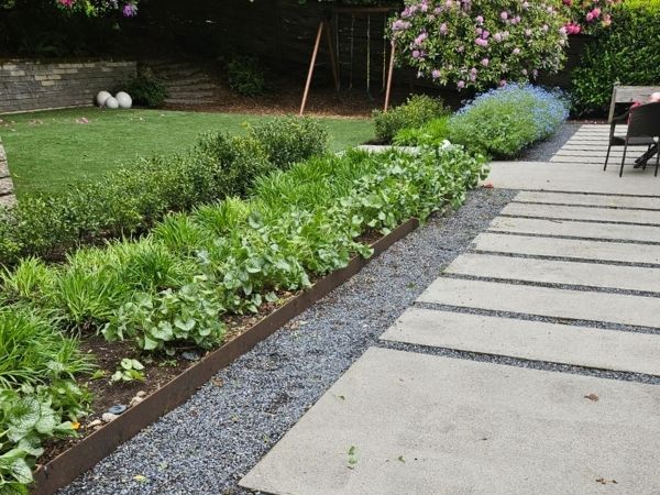 Olimipic stepping stones with gravel and native planting