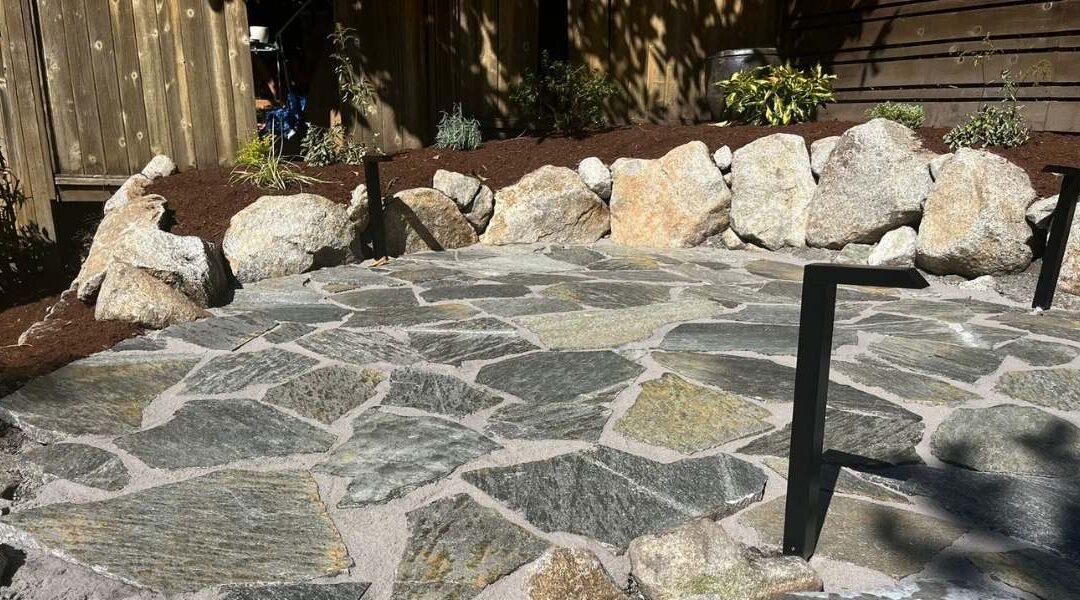 Natural stone patios integrated in a backyard
