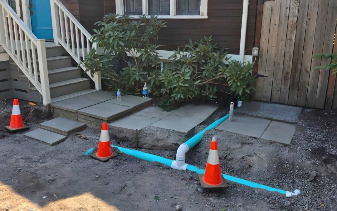 Downspout extension installation in a Seattle home
