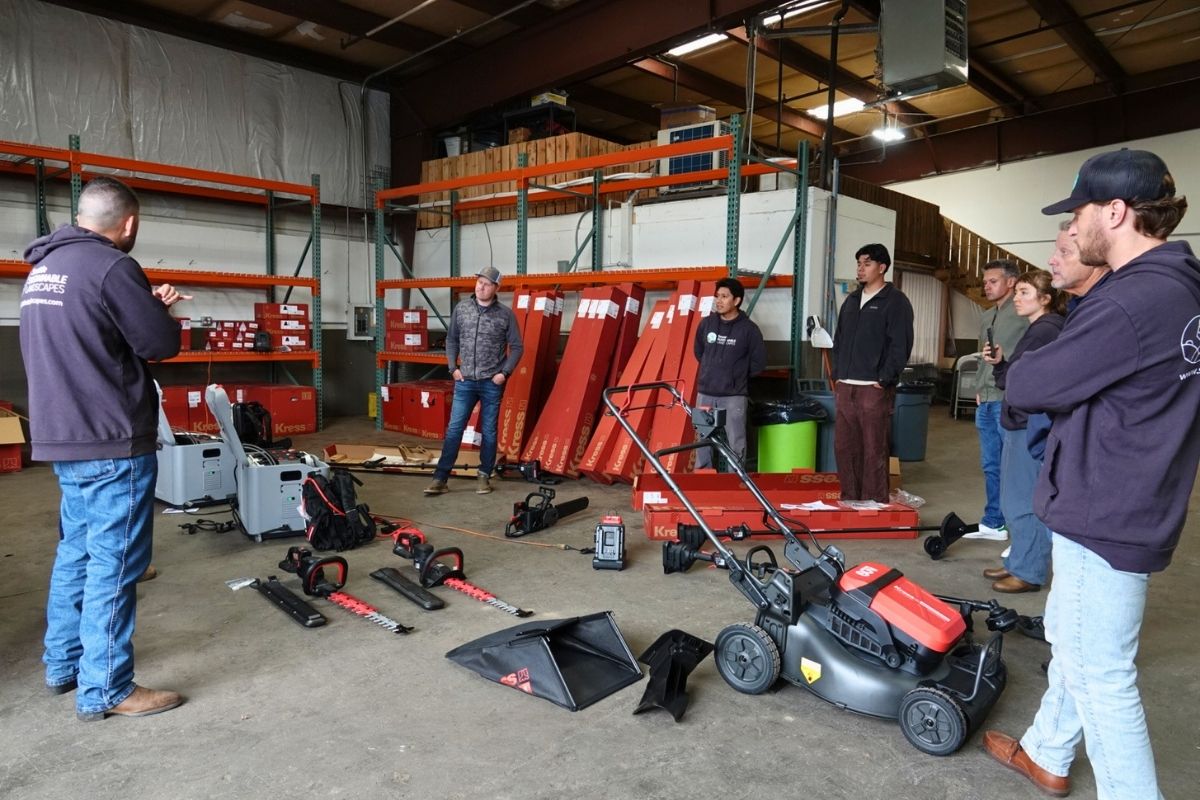 Landscape maintenance crew participating in electric equipment training in Seattle.