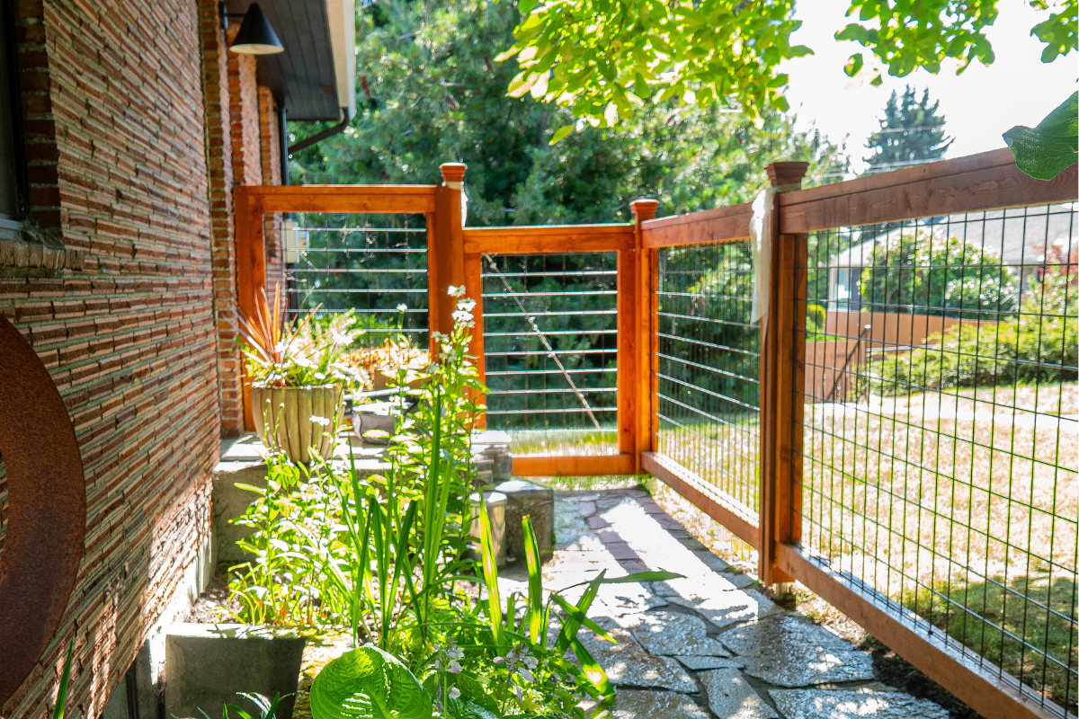 Hog Wire Fence in Seattle home, surrounded by plantings
