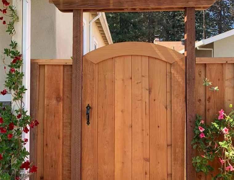 Arched Wooden Gate
This style features a curved top that can add a touch of elegance and sophistication to your property. 