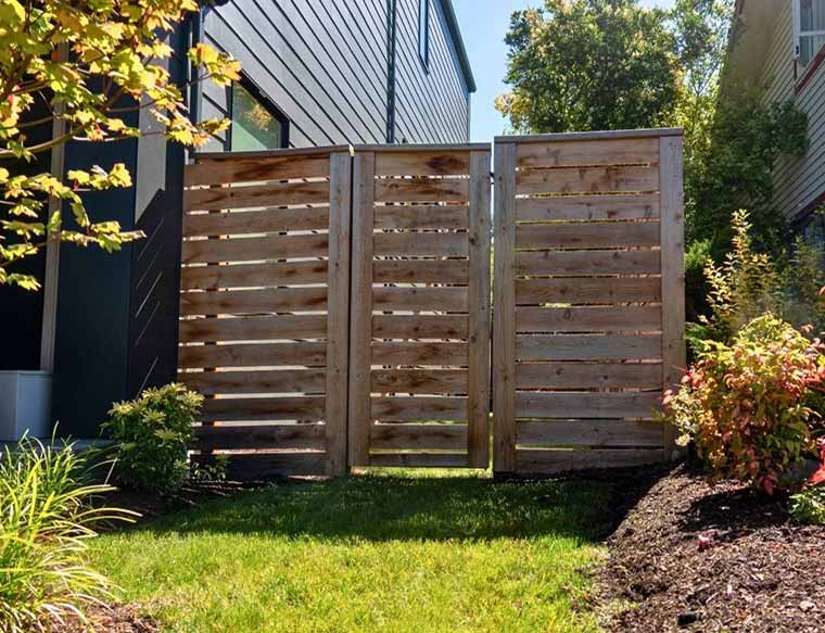 Classic Wooden Gate
This style is often made of cedar or redwood and can feature either a single or double swing.